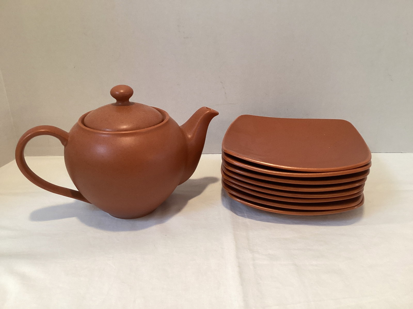Noritake Stoneware Colorwave Bread Plates and Teapot: Eight 6 1/2" diameter plates