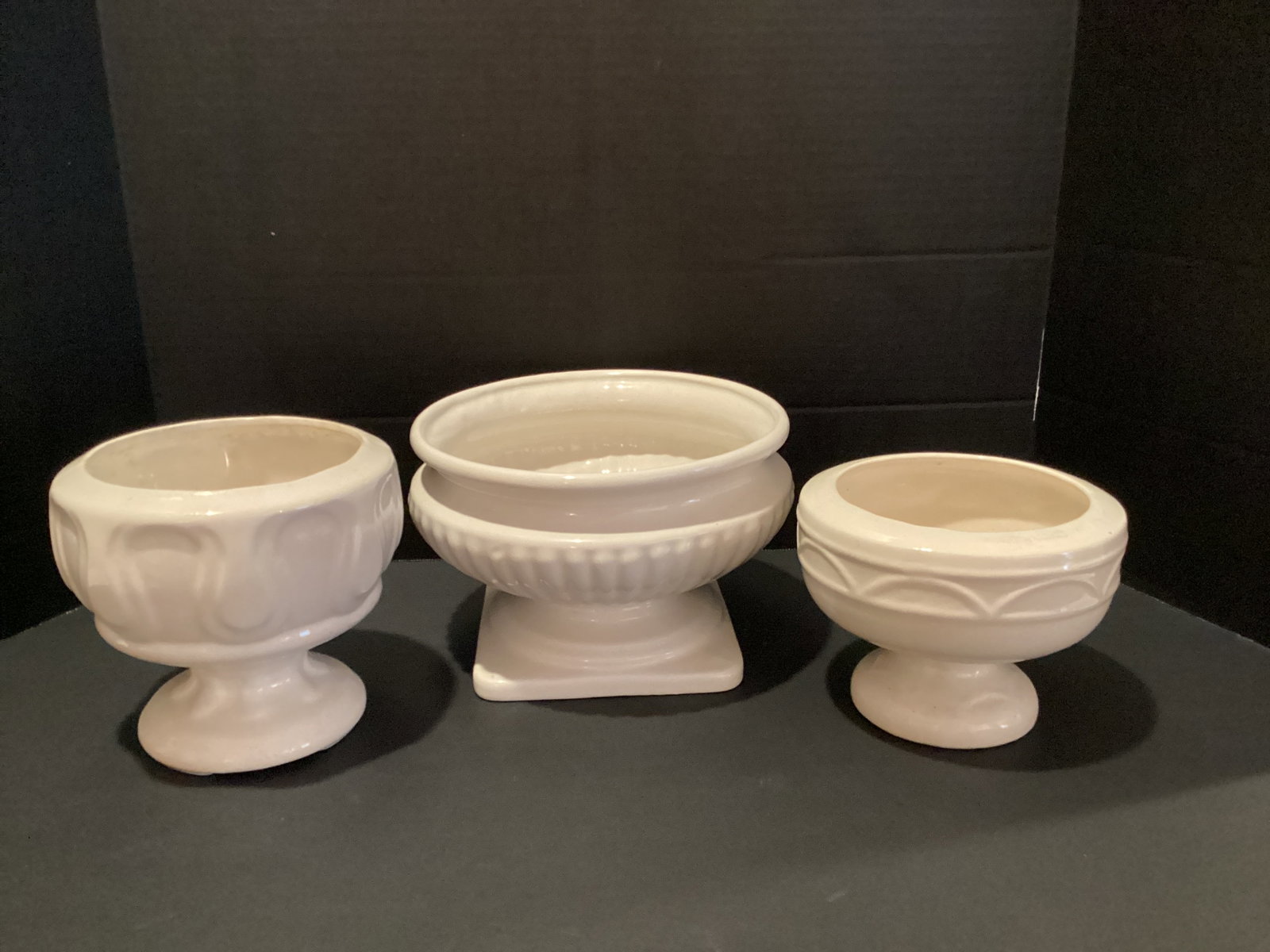Three White Ceramic Pedestal Planters: 5" to 6" h