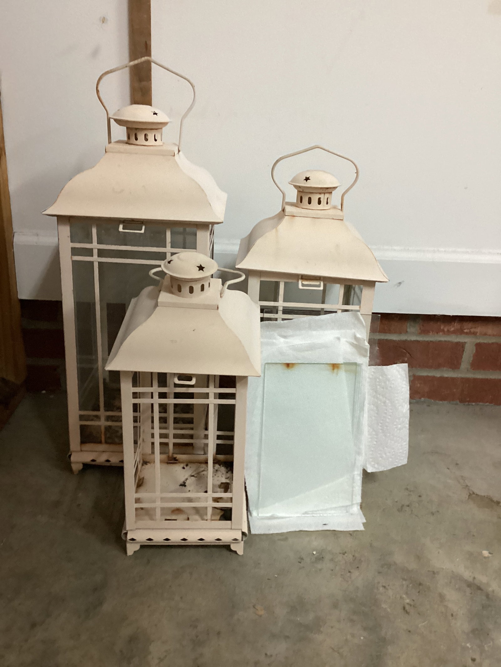 Three Candle Lanterns: weathered, some rust, glass loose, shipping unavailable for this lot