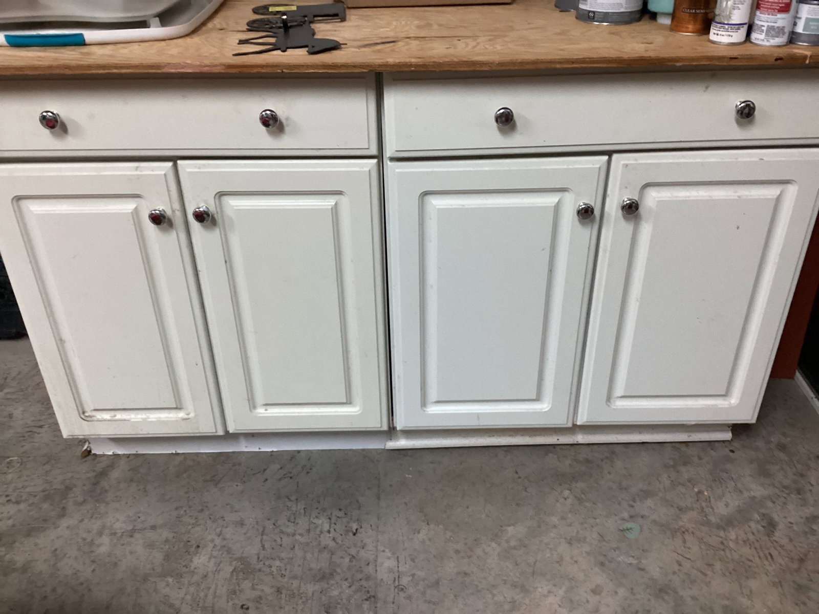 Two White Cabinets with Plywood Top: also has some contents, 60" total width x 28" d x 35" h, shipping unavailable for this lot