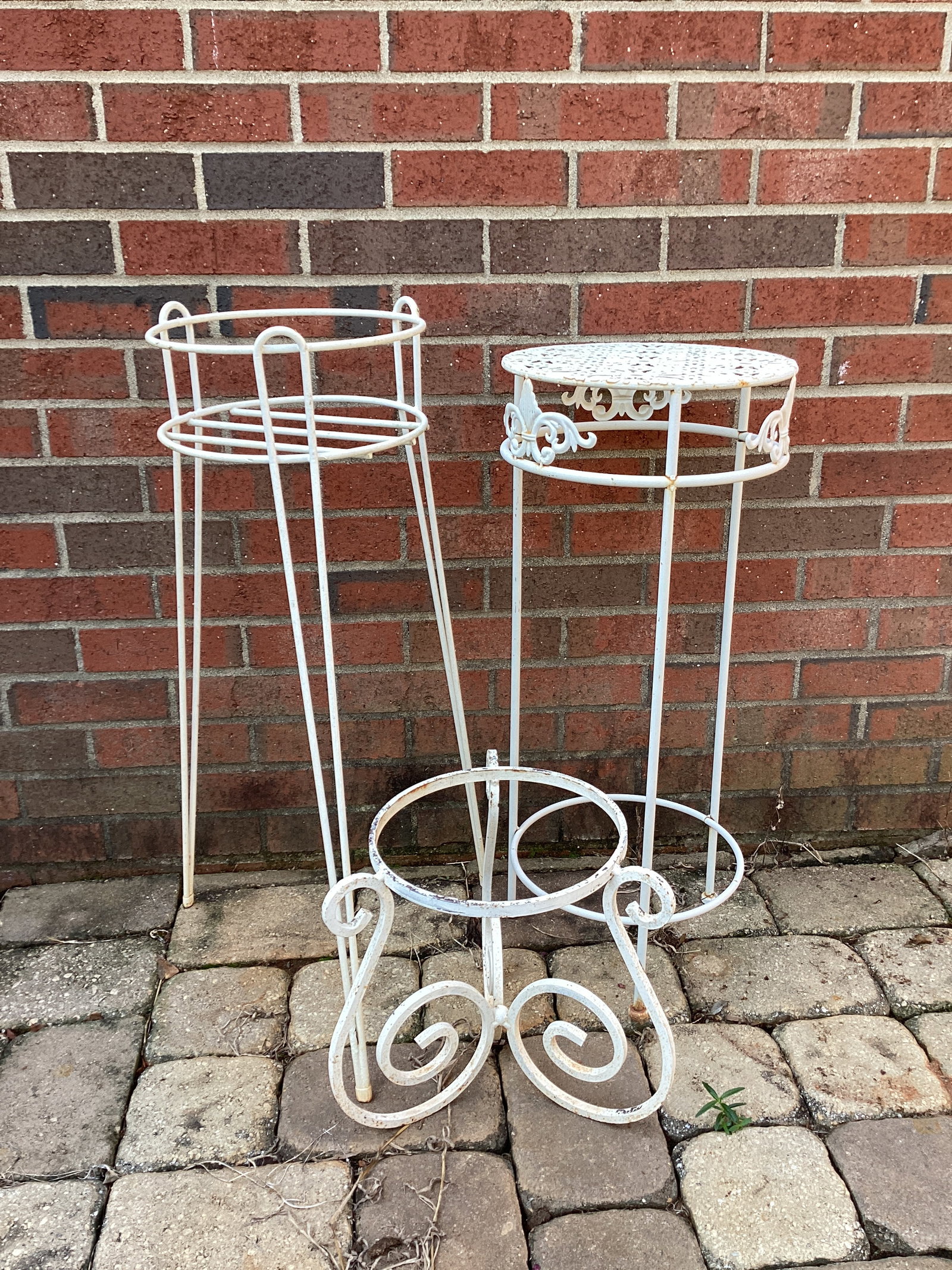 Three Metal Plant Stands: 29", 27 1/2", and 12" tall, shipping unavailable for this lot
