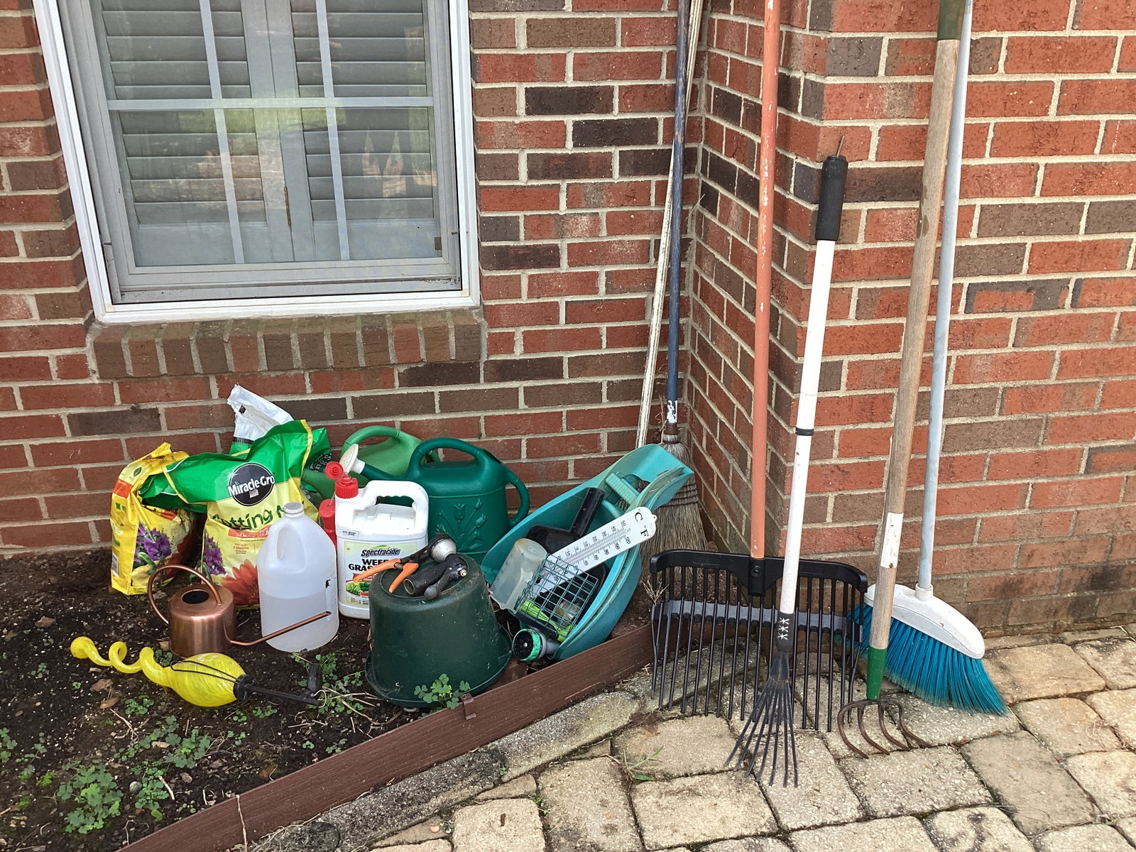 Gardening Items - Potting Soil, Watering Cans, Rake, and More: shipping unavailable for this lot