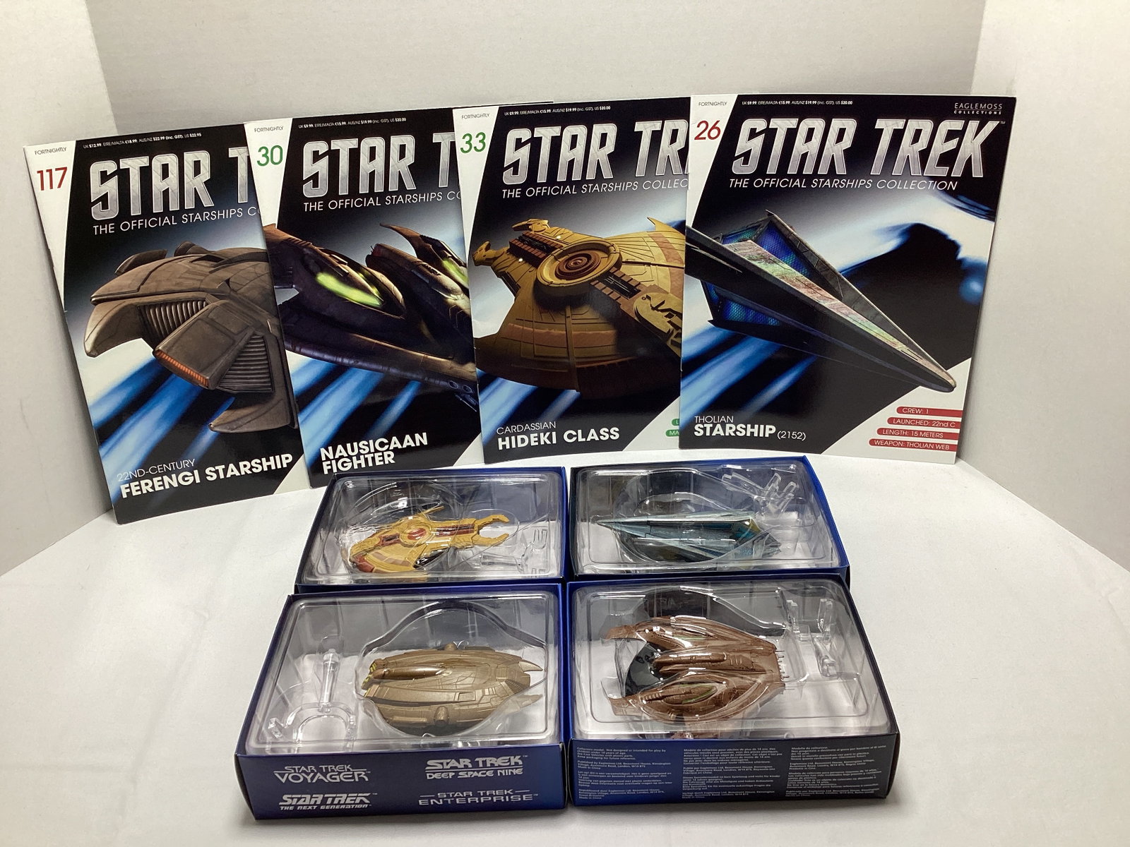 Four Eaglemoss Star Trek Diecast Starships with Magazines: appears new in box, Tholian Starship, Cardassian Hideki Class, Nausicaan Fighter, 22nd Century Ferengi Starship
