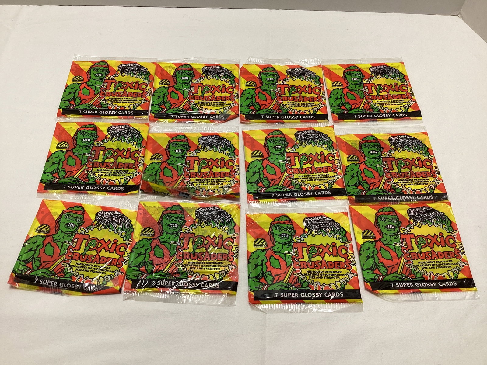 12 Sealed Toxic Crusaders Trading Card Packs: .