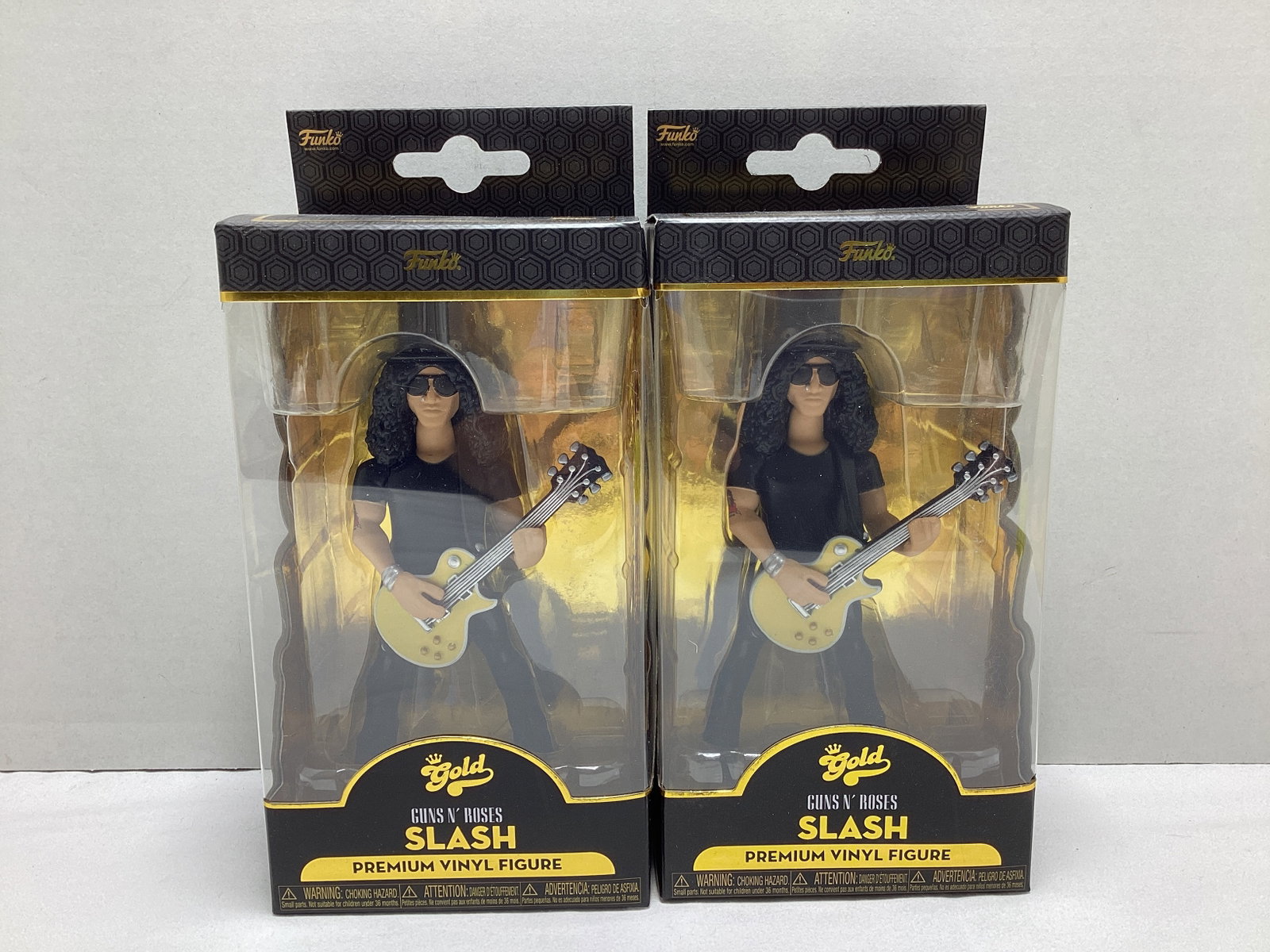Two Funko Gold Guns N Roses Slash Vinyl Figures: .