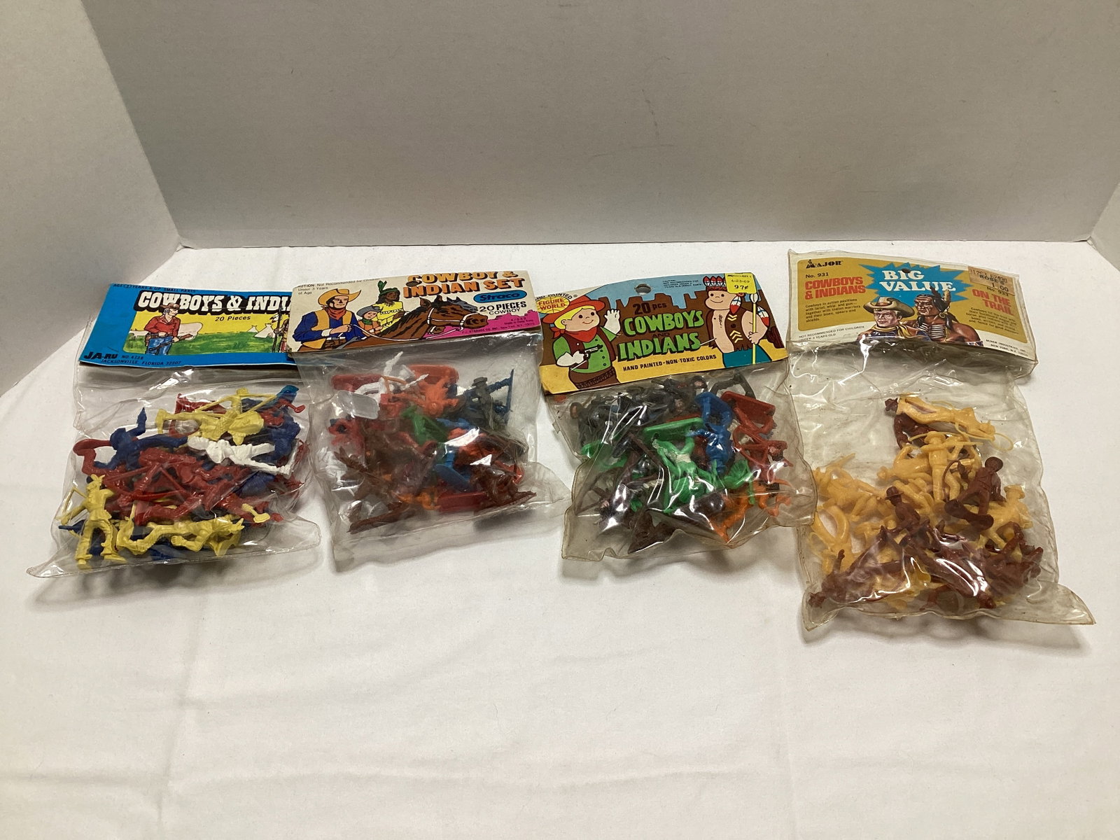 Four Cowboy and Indian Plastic Figure Sets: .