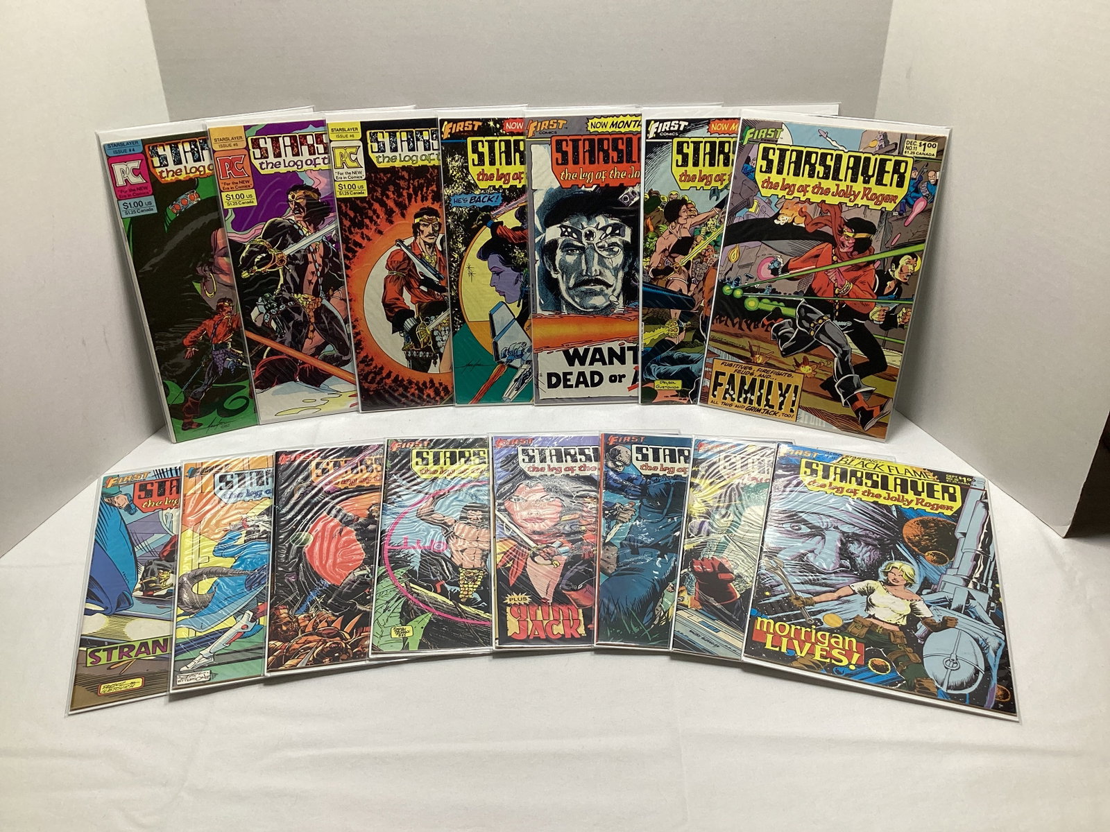 Starslayer Log of the Jolly Roger First Comic Books: .