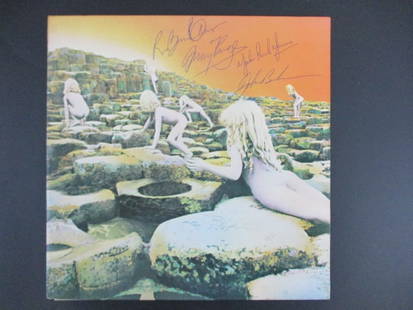 Led Zeppelin Signed Houses of the Holy Album Cover with Certificate: "Enjoy FREE shipping on all items in this auction!"Led Zeppelin Signed Houses of the Holy Album Cover with Certificate of Authenticity.Offered is a stunning and highly sought-after Houses of the Holy