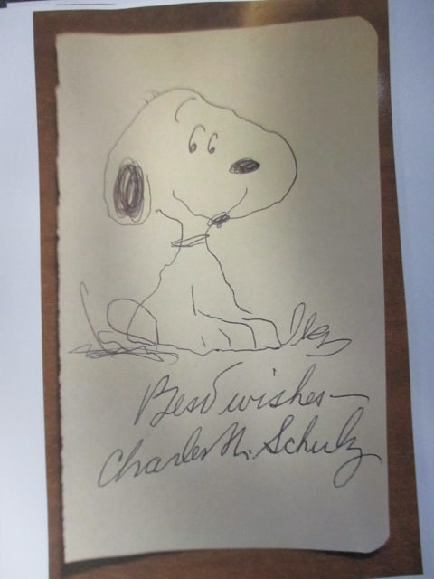 Charles Schulz Signed Album Page – Inscribed “Best Wishes” (1 of 1)