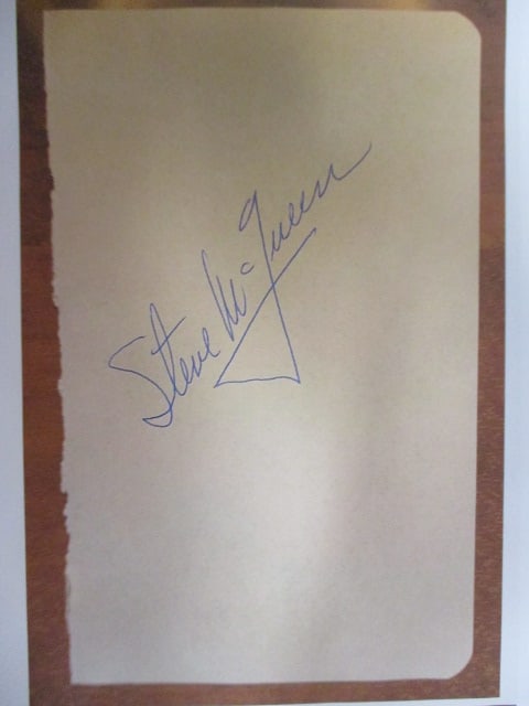 Steve McQueen Signed Album Book Page: Presented here is a rare album book page signed by Steve McQueen, the legendary “King of Cool” and one of Hollywood’s most iconic actors. Known for his magnetic screen presence, effortless s