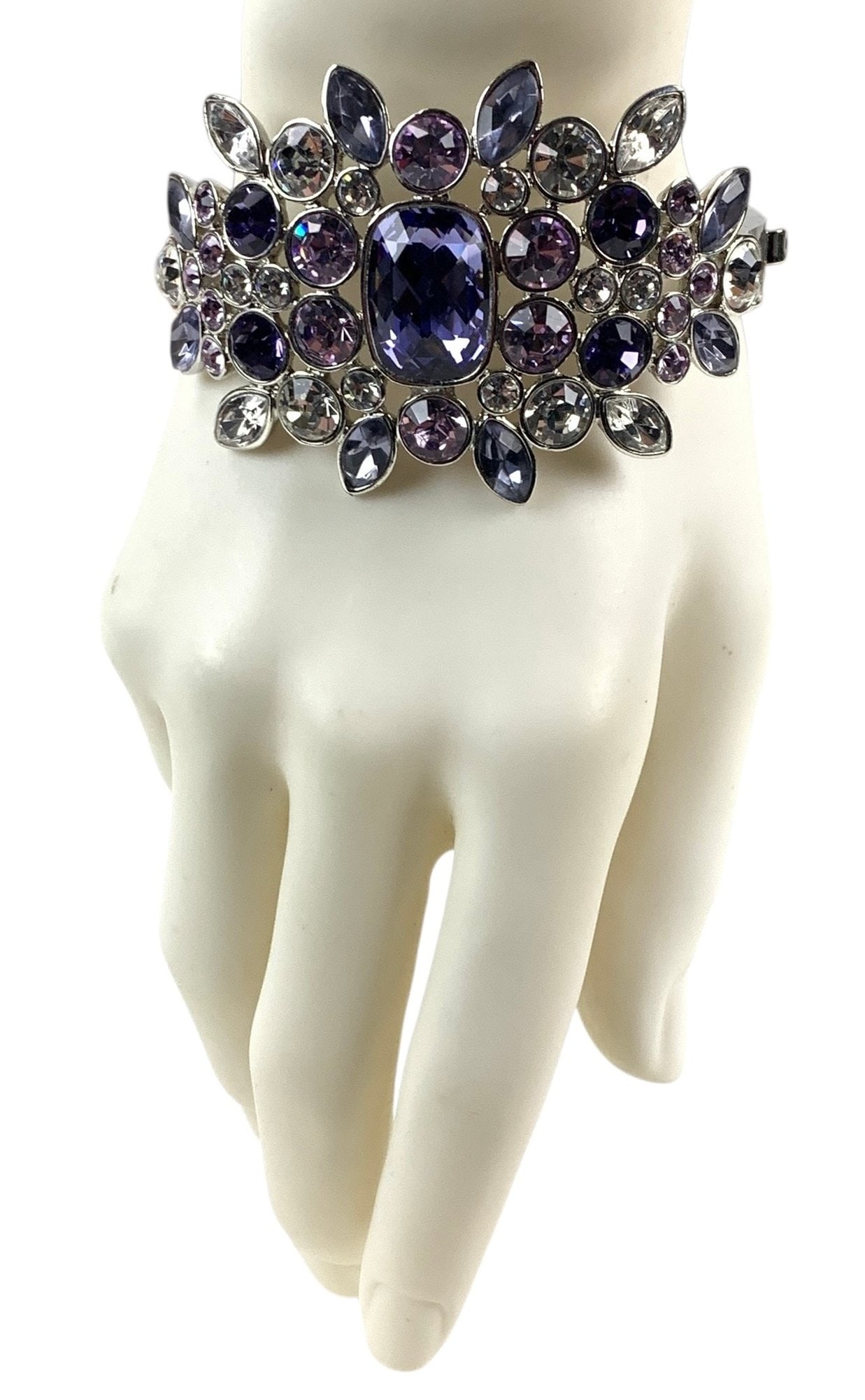 Givenchy Silver Tone Cuff Bracelet With Purple & Clear Stones - #S19-3: Stamped "GIVENCHY" on the interior. Surface wear consistent with normal usage. Approximate Measurements: 2"H x 2-3/4" LOCAL PICK-UP: SATURDAY, FEBRUARY 21ST FROM 11AM-3PM. LOCATION: 35 MECHANIC STREET