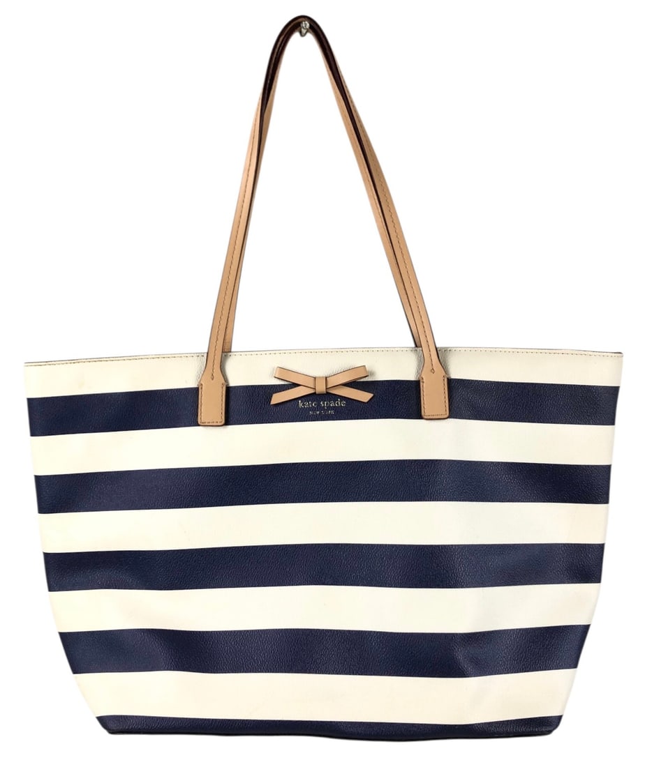 Kate Spade New York Margareta Sawyer Street Leather Tote - #S12-2: Features navy blue and white stripes with a beige bow on the front, Kate Spade New York logo fabric on the interior, zippered interior pocket and zippered outer closure. Overall good pre-owned conditi