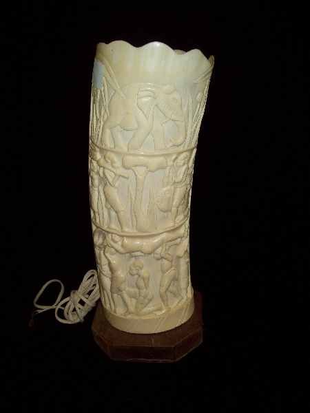 Lighting: Carved Rhinoceros Tusk lamp. 15 inches high x 4.5 inches wide