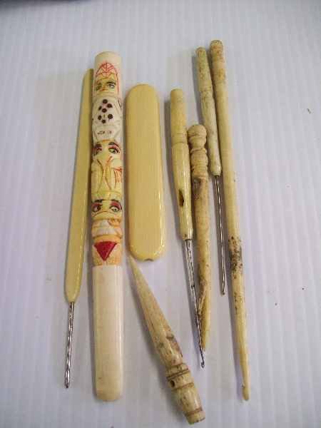 Ivory: 8 carved ivory items- totem pole, stitching needles. (WE DO NOT EXPORT IVORY) Largest measures 5.5 inches, smallest measures 2.5 inches