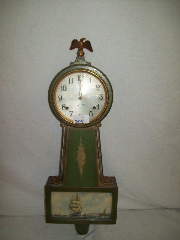 CLOCK: SESSIONS GREEN PAINTED WALL HANGING CLOCK. 27 INCHES HIGH X 9 INCHES WIDE