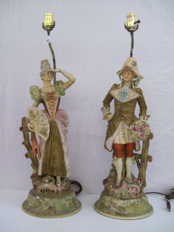 LIGHTING: PAIR MAN & WOMAN FIGURE LAMPS. NECK ON WOMAN REPAIRED, FLOWER MISSING FROM MANS HAND. 30 INCHES HIGH X 9 INCHES WIDE