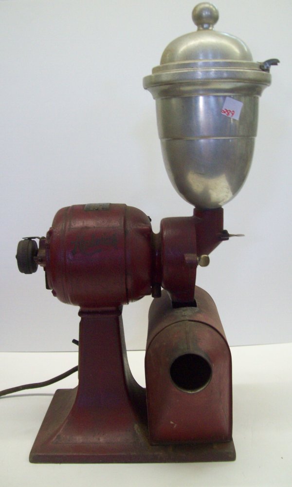 COFFEE: COFFEE GRINDER- ELECTRIC WITH ORIGINAL RED PAINT- USED CONDITION MAKER-HOLWICK/THE MOTOR IS ROLLINS & MEYERS-SOME RUST HANDLE NEEDS TLC 27H X 13D X 9W