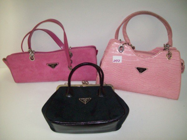 3 PRADA STYLE POCKET BOOKS: 3 PRADA STYLE POCKET BOOKS. USED CONDITION. 16 INCHES X 12 INCHES