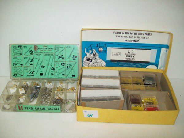 FISHING LURES DISPLAY: COLLECTION OF VARIOUS FISHING LURES INCLUDING BEAD CHAIN TACKLE & J.T. ASSORTED KIRBY HOOKS. LARGEST MEASURES 10 INCHES WIDE X 7 INCHES HIGH