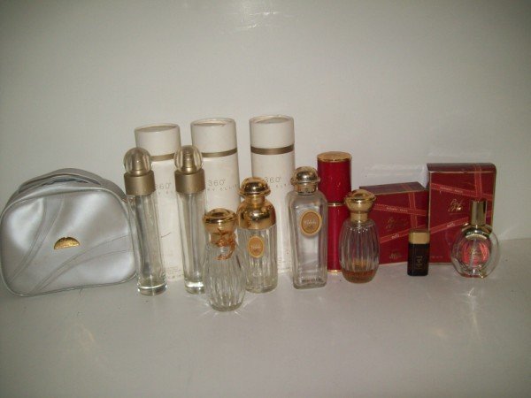 COLLECTION OF PERFUME BOTTLES: COLLECTION OF PERFUME BOTTLES INCLUDING PERRY ELLIS; HERMES; CARTIER, SOME WITH BOXES. BOTTLES ONLY NO PERFUME.