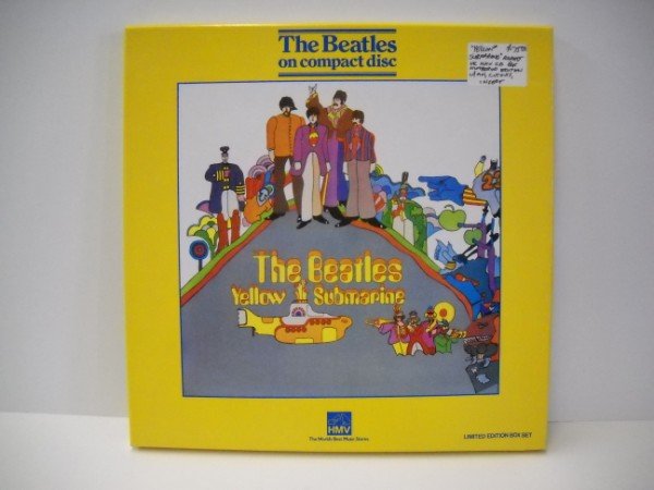 BEATLES DISC SET: THE BEATTLES "YELLOW SUBMARINE" LIMITED EDITION CD DISC SET. DISC, POSTER, PIN.