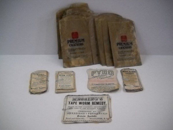 ADVERTISING: COLLECTION OF VARIOUS ADVERTISING ITEMS INCLUDING NABISCO CRACKERS WAX BAGS; PHARMACY BOTTLE LABELS; TAPE WORM REMEDY LABELS; NERVE & BONE LINIMENT LABELS. LARGEST MEASURES 6 INCHES