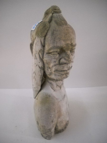 STATUE: CONCRETE STATUE OF INDIAN. SOME CHIPPING. 11 1/2 INCHES HIGH X 6 1/2 INCHES WIDE.