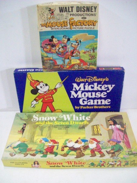GAME/PUZZLE: 1 MICKEY MOUSE FACTORY PUZZLE. GAMES INCLUDE: SNOW WHITE AND THE SEVEN DWARFS; MICKEY MOUSE. USED CONDITION. 19 INCHES WIDE X 9 1/2 INCHES HIGH