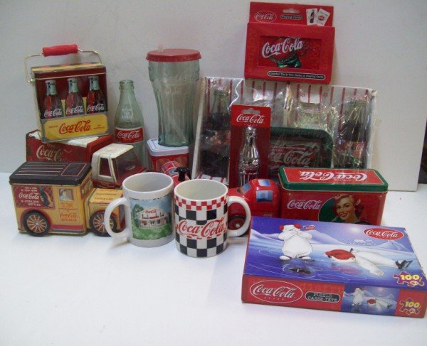 COCA COLA ADVERTISING: COCA COLA ADVERTISING ITEMS INCLUDING: PUZZLE; MUGS; TRUCKS; TINS. SCRATCHES; RUST. LARGEST MEASURES 13 INCHES WIDE X 9 INCHES HIGH