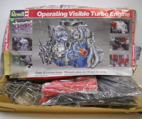 MODEL KIT: OPERATING VISIBLE TURBO ENGINE MODEL KIT BY REVELL 1985. USED CONDITION; BOX TORN; STAINED. 31 INCHES X 16 INCHES X 4 INCHES