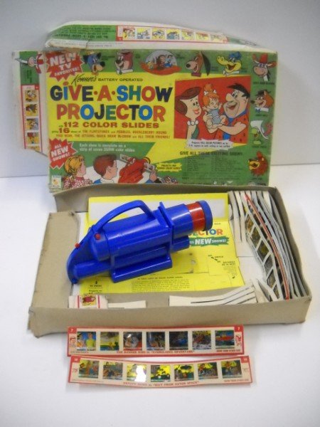 TOY: GIVE A SHOW PROJECTOR 1963 BY KENNER IN ORIGINAL BOX WITH SOME SILDES. BOX TORN; STAINED; USED CONDITION. 17 INCHES X 11 INCHES X 2 1/2 INCHES