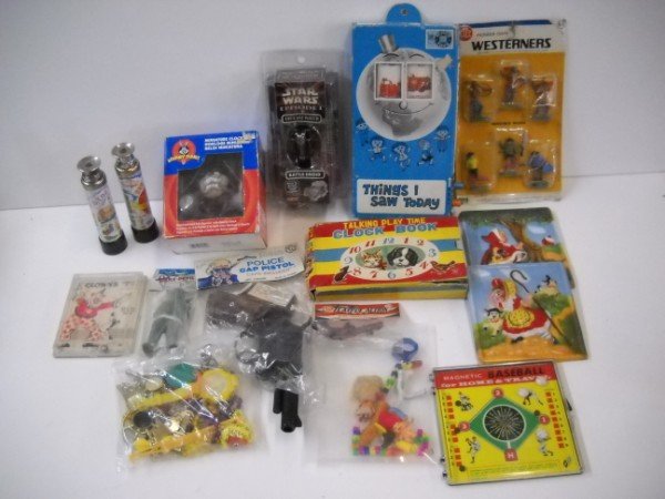 TOYS: VARIOUS TOYS INCLUDE POLICE CAP PISTOL; STAR WARS WATCH; CLOCK BOOK. BOXES PEALING; USED CONDITION. LARGEST MEAURES 11 INCHES