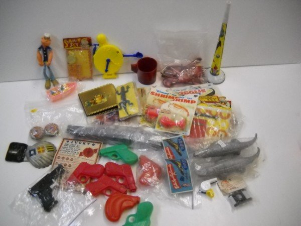 TOYS: COLLECTION OF VARIOUS TOYS INCLUDING POPEYE FIGURE; WATER GUNS; MANICURE SET. SOME IN ORIGINAL PACKAGES. USED CONDITION. LARGEST MEASURES 6 INCHES