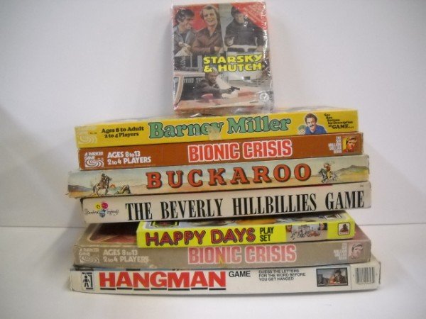 GAMES: 7 GAMES INCLUDING BARNEY MILLER; HANGMAN; BEVERLY HILLBILLIES; 2 SIX MILLION DOLLAR MAN; BUCKAROO; & STARSKY & HUTCH PUZZLE. USED CONDITION; BOXES TORN; TAPED; WEAR. LARGEST MEASURES 19 INCHES