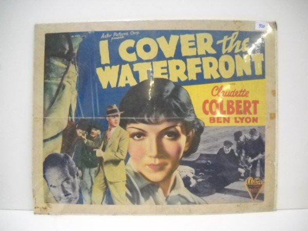 MOVIE POSTER: I COVER THE WATERFRONT WITH CLAUDETTE COLBERT, BEN LYON MOVIE POSTER. 22 INCHES X 28 INCHES. CALL 845-457-7550 OR EMAIL STERLINGAUCTION@AOL.COM FOR FULL CONDITION REPORT, SHIPPING/PACKING QUOTES PRIOR