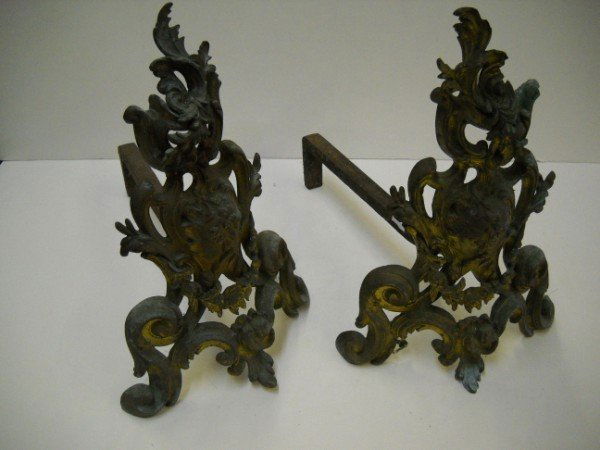 ANDIRONS: SET OF ORNATE GILT IRON ANDIRONS. GILT IS FADED. 14 INCHES X 10 INCHES X 16 INCHES. CALL 845-457-7550 OR EMAIL STERLINGAUCTION@AOL.COM FOR FULL CONDITION REPORT, SHIPPING/PACKING QUOTES PRIOR TO BIDDI