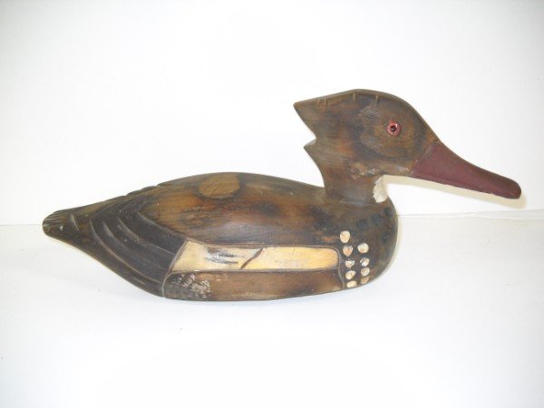 WOOD DUCK DECOY: WOOD DUCK DECOY WITH GLASS EYES. 1 GLASS EYE CRACKED; SCRATCHES; PAINT LOSS. 15 1/2 INCHES WIDE X 6 1/2 INCHES HIGH X 4 1/2 INCHES DEEP. CALL 845-457-7550 OR EMAIL STERLINGAUCTION@AOL.COM FOR FULL CON