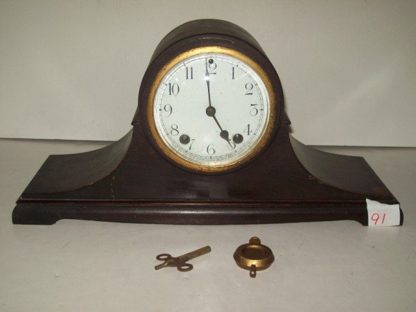 CAMEL BACK CLOCK: CAMEL BACK MANTLE CLOCK BY NEW HAVEN CLOCK CO. WITH KEY. SCRATCHES. 16 INCHES X 7 1/2 INCHES. CALL 845-457-7550 OR EMAIL STERLINGAUCTION@AOL.COM FOR FULL CONDITION REPORT, SHIPPING/PACKING QUOTES PRIO