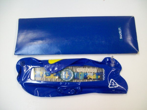 WATCH: THE BEATLES YELLOW SUBMARINE SWATCH WATCH & INFLATABLE SUBMARINE WITH ORIGINAL BOX. CALL 845-457-7550 OR EMAIL STERLINGAUCTION@AOL.COM FOR FULL CONDITION REPORT, SHIPPING/PACKING QUOTES PRIOR TO BIDDI