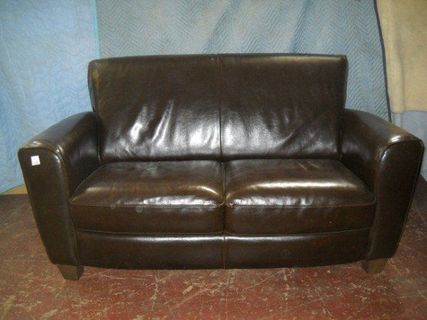 LEATHER LOVESEAT: BROWN LEATHER LOVESEAT BY NATUZZI. 33 1/2 INCHES HIGH X 28 1/2 INCHES DEEP X 61 1/2 INCHES WIDE. CALL 845-457-7550 OR EMAIL STERLINGAUCTION@AOL.COM FOR FULL CONDITION REPORT, SHIPPING/PACKING QUOTES P