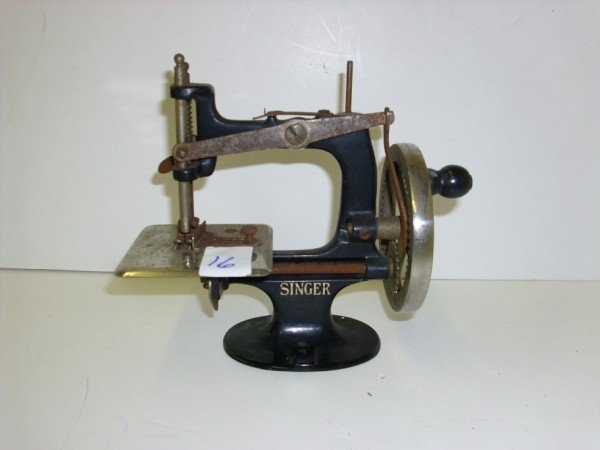 SEWING MACHINE: THE SINGER MANFG. CO MINI SEWING MACHINE; GRAYBAR INSTUCTION MANUAL. RUST; SCRATCHES. 6 INCHES LONG X 3 1/2 INCHES WIDE X 6 INCHES HIGH. CALL 845-457-7550 OR EMAIL STERLINGAUCTION@AOL.COM FOR FULL CON