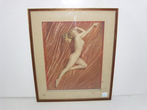NUDE PRINT: NUDE POSSIBLE TO OF MARILYN MONROE CALANDER PRINT BY TOM KELLEY STUDIOS TITLED A NEW WRINKLE. CREASES; FOXING; HOLE. SCRATCHES TO FRAME. FRAMED MEASURES 15 INCHES X 18 INCHES.
