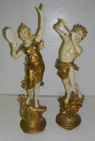 STATUES: 2 POT METAL BOY & GIRL STATUES. PAINT LOSS. 23 INCHES X 6 INCHES.