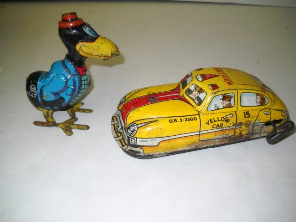 WIND UP TIN TOYS: 2 TIN WIND UP TOYS INCLUDING MARX BIRD; & TAXI CAB. RUST; PAINT LOSS; SCRATCHES. LARGEST MEASURES 7 INCHES