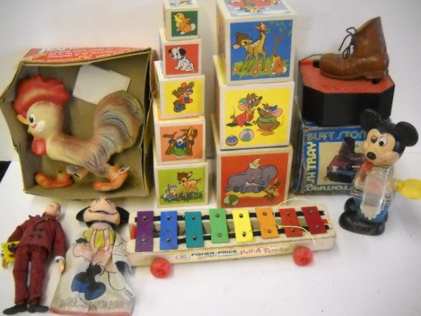 TOY LOT: TOY LOT INCUDING MICKEY MOUSE HAND PUPPET; DISNEY NESTING STACKING BLOCKS; RUBBER ROOSTER. ROOSTER LEG OFF; USED CONDITION. LARGEST MEASURES 14 INCHES X 4 INCHES.