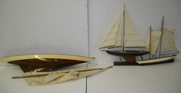 POND BOATS: 3 WOOD POND BOATS. SAILS HAVE TEARS; ETC. LARGEST MEASURES 35 INCHES X 8 INCHES.