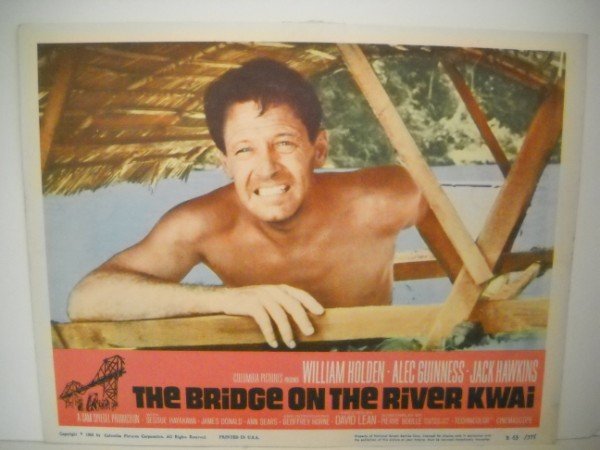 LOBBY CARD: LOBBY CARD - THE BRIDGE ON THE RIVER KWAI WITH WILLIAM HOLDEN, ALEC GUINNESS, JACK HAWKINS. 1963. USED CONDITION.