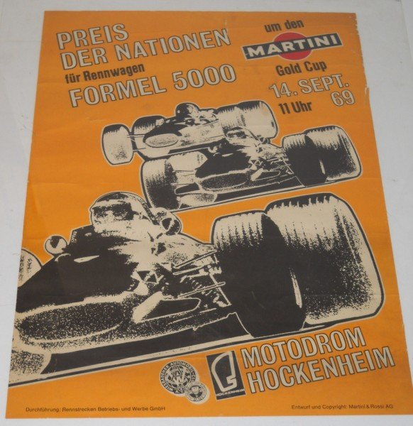 RACING POSTER: 1969 MOTODROM HOCKENHEIM MARTINI GOLD CUP RACING POSTER. CREASES; APPROX 3 INCH TEAR; EDGE TORN. 33 INCHES X 23 INCHES.
