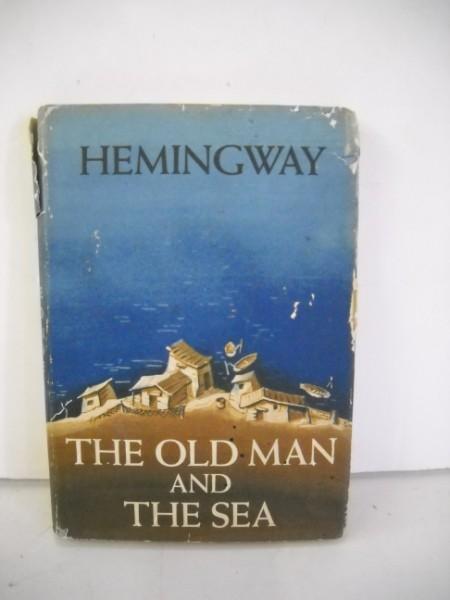 BOOK: THE OLD MAN AND THE SEA FIRST EDITION 1952 BY ERNEST HEMINGWAY. COVER TEARS. 8 INCHES X 6 INCHES