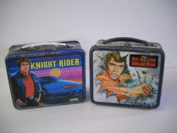 LUNCH BOXES: 2 TIN LUNCH BOXES INCLUDING KNIGHT RIDER & SIX MILLION DOLLAR MAN. USED CONDITION; PAINT LOSS; SCRATCHES; RUST.